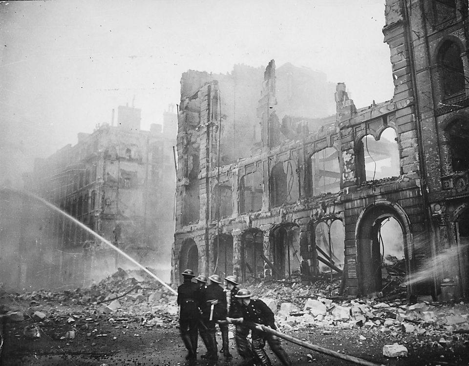 Firefighters putting out a blaze in London after an air raid during The Blitz in 1941.