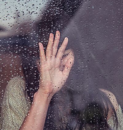 Woman; Rainy Window